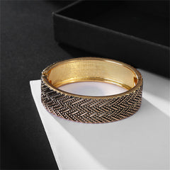 Beautifully crafted 18K gold-plated bracelet showcasing a woven pattern, a timeless piece for any jewelry lover.