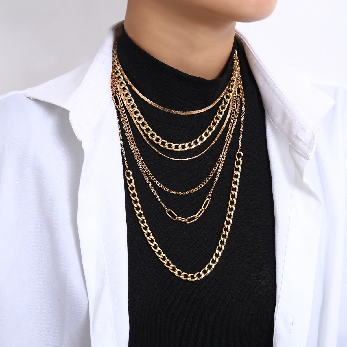 Stunning multi-layered Cuban chain necklace in 18K gold plating, perfect for adding elegance to any outfit.