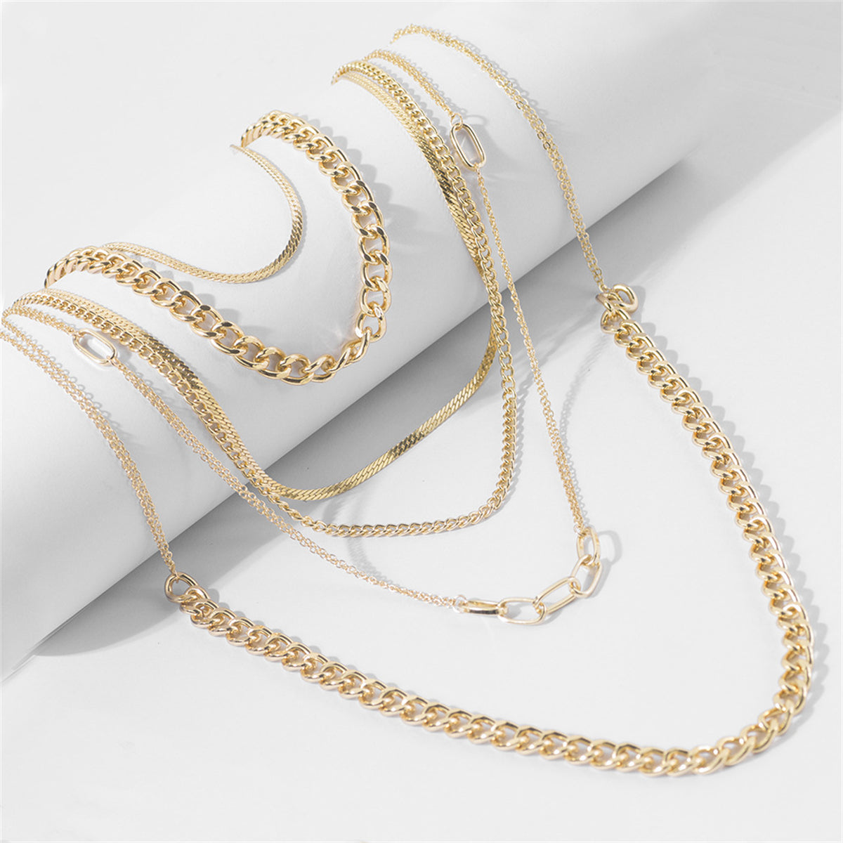 Beautifully crafted 18K gold-plated Cuban chain necklace with multiple layers, perfect for a stylish statement piece.