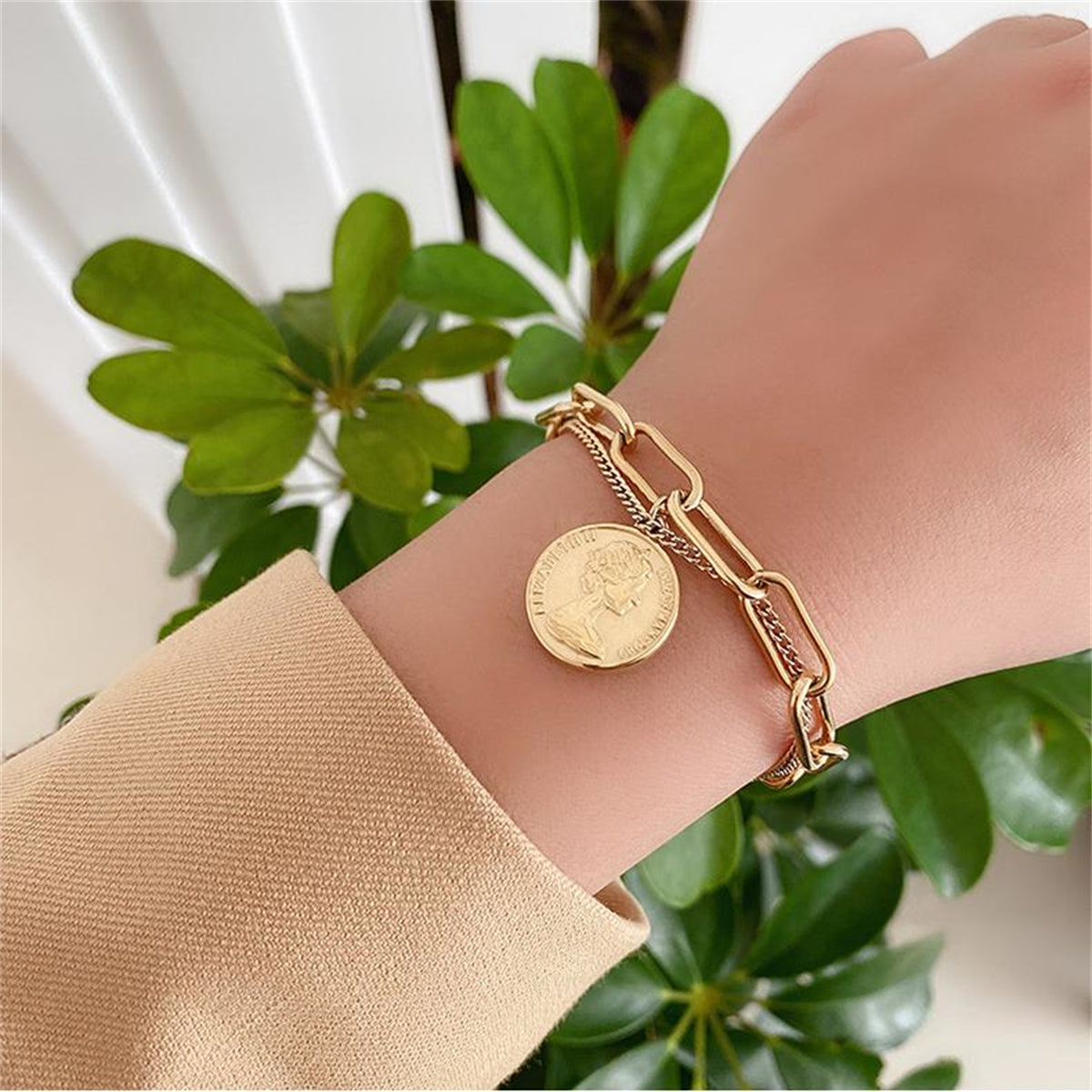 Elegant 18K gold-plated bracelet featuring a stunning coin charm, perfect for adding a touch of luxury to any outfit.