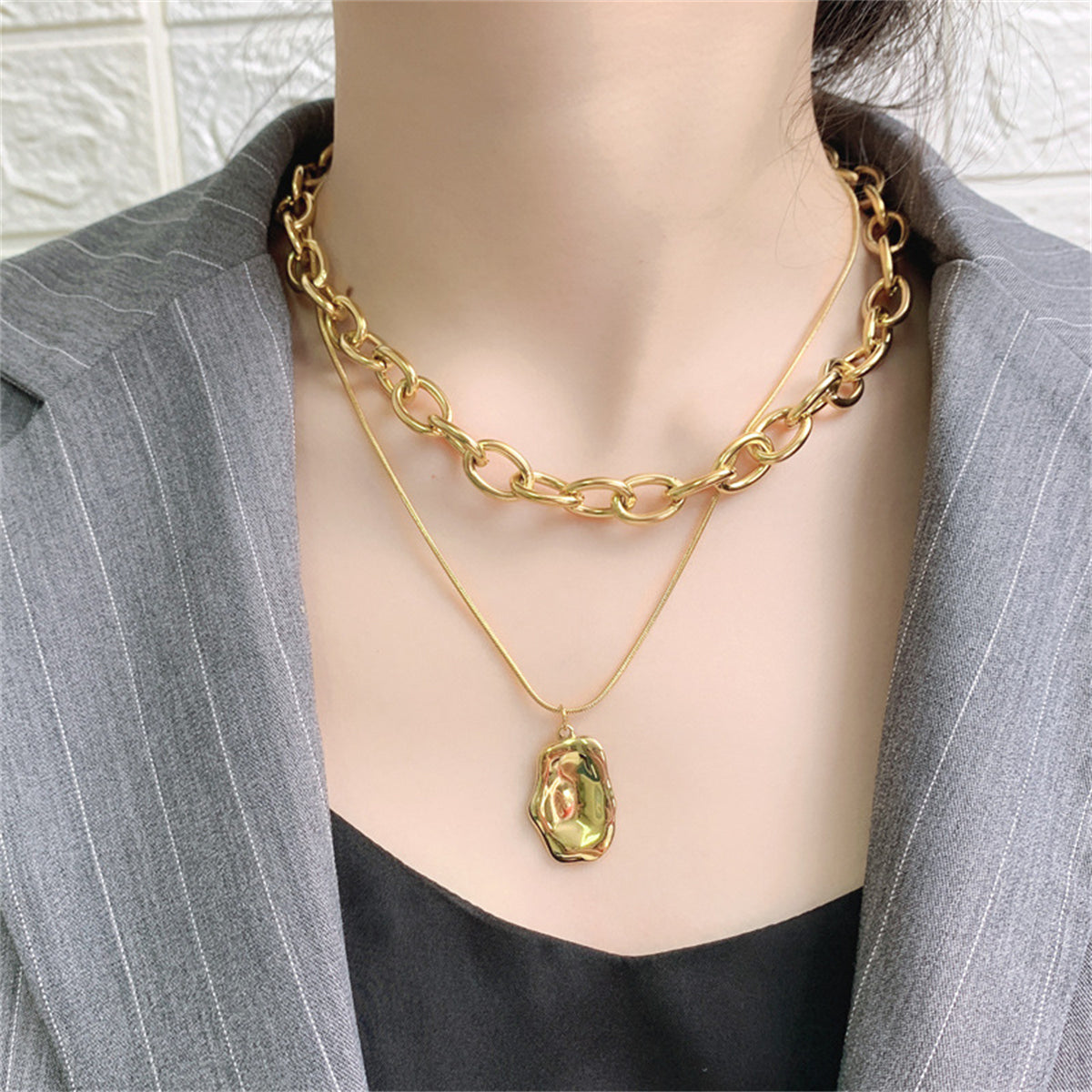 18K gold-plated cable chain necklace with a layered pendant, combining elegance and style for a standout accessory.