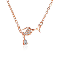 Elegant rose gold necklace featuring a diamond heart pendant, perfect for adding a touch of luxury to any outfit.