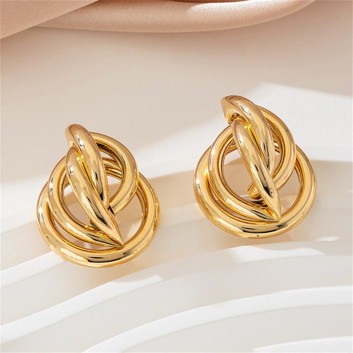 Beautiful 18K gold-plated earrings with a circular design, adding a touch of elegance to your jewelry collection.