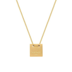 Timeless vintage life necklace in gold, featuring an 18K gold-plated dog tag pendant for a stylish and elegant look.