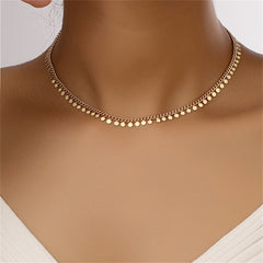 Elegant 18K gold-plated disc necklace featuring a delicate chain adorned with small beads for a touch of sophistication.