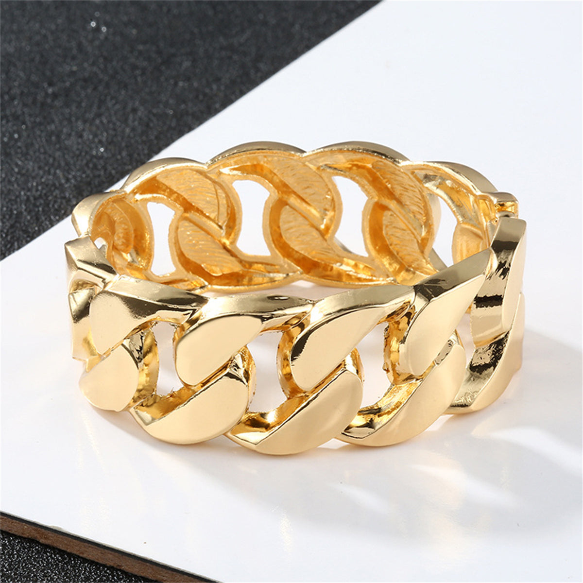 Fashionable 18K gold-plated curb-chain bangle with a distinctive large link, perfect for adding flair to any outfit.