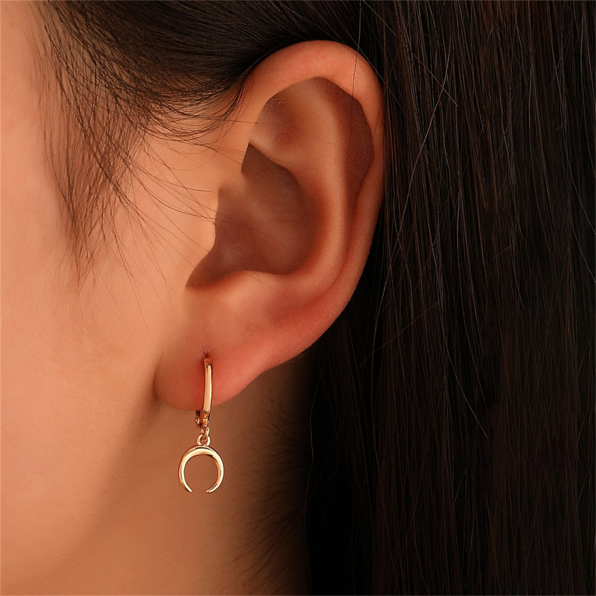 Elegant 18K gold-plated crescent moon huggie earrings, perfect for adding a touch of sophistication to any outfit.