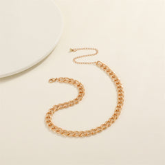 The luxurious 18K gold-plated Cuban chain necklace emphasizes its elegant design.