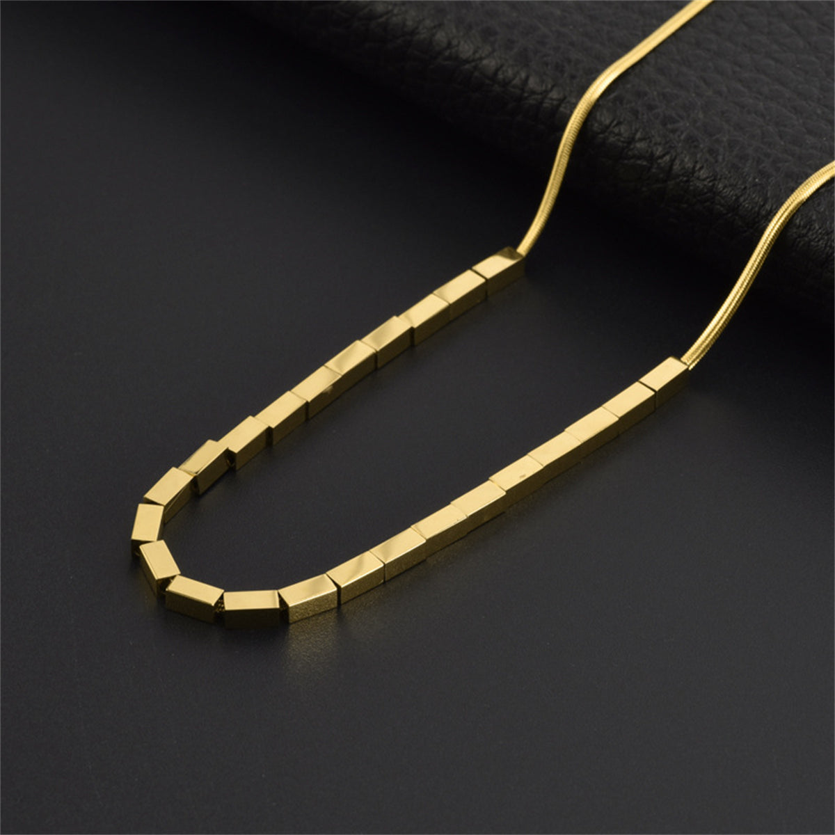 Eye-catching 18K gold-plated necklace adorned with modern rectangular blocks, a timeless addition to your jewelry collection.