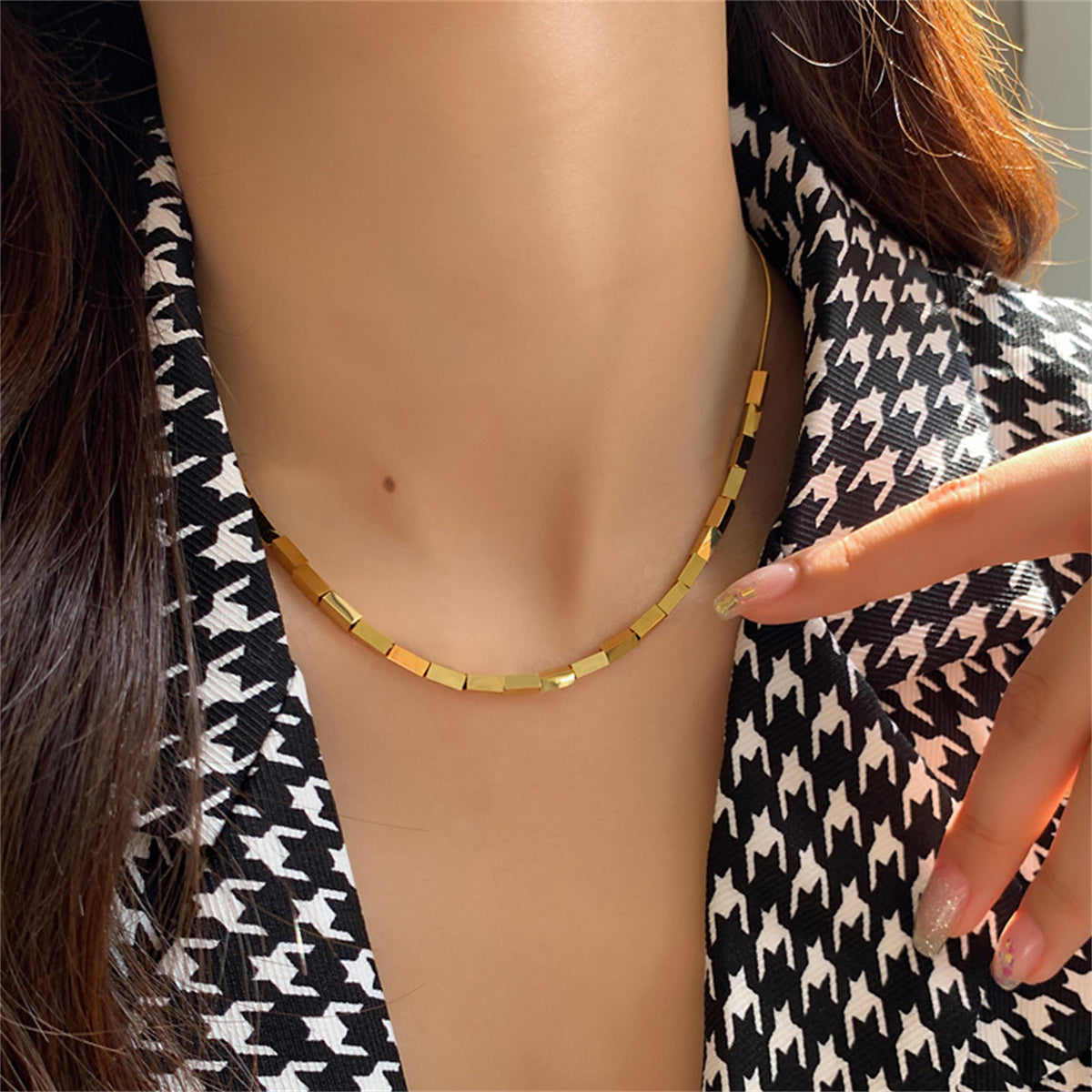 Luxurious 18K gold-plated cuboid necklace with unique rectangular blocks, perfect for adding elegance to any ensemble.