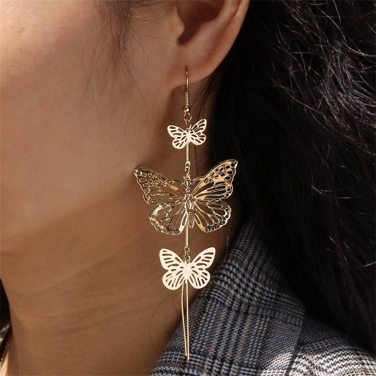 Exquisite double butterfly drop earrings in 18K gold plating, showcasing long chains for a striking and elegant appearance.