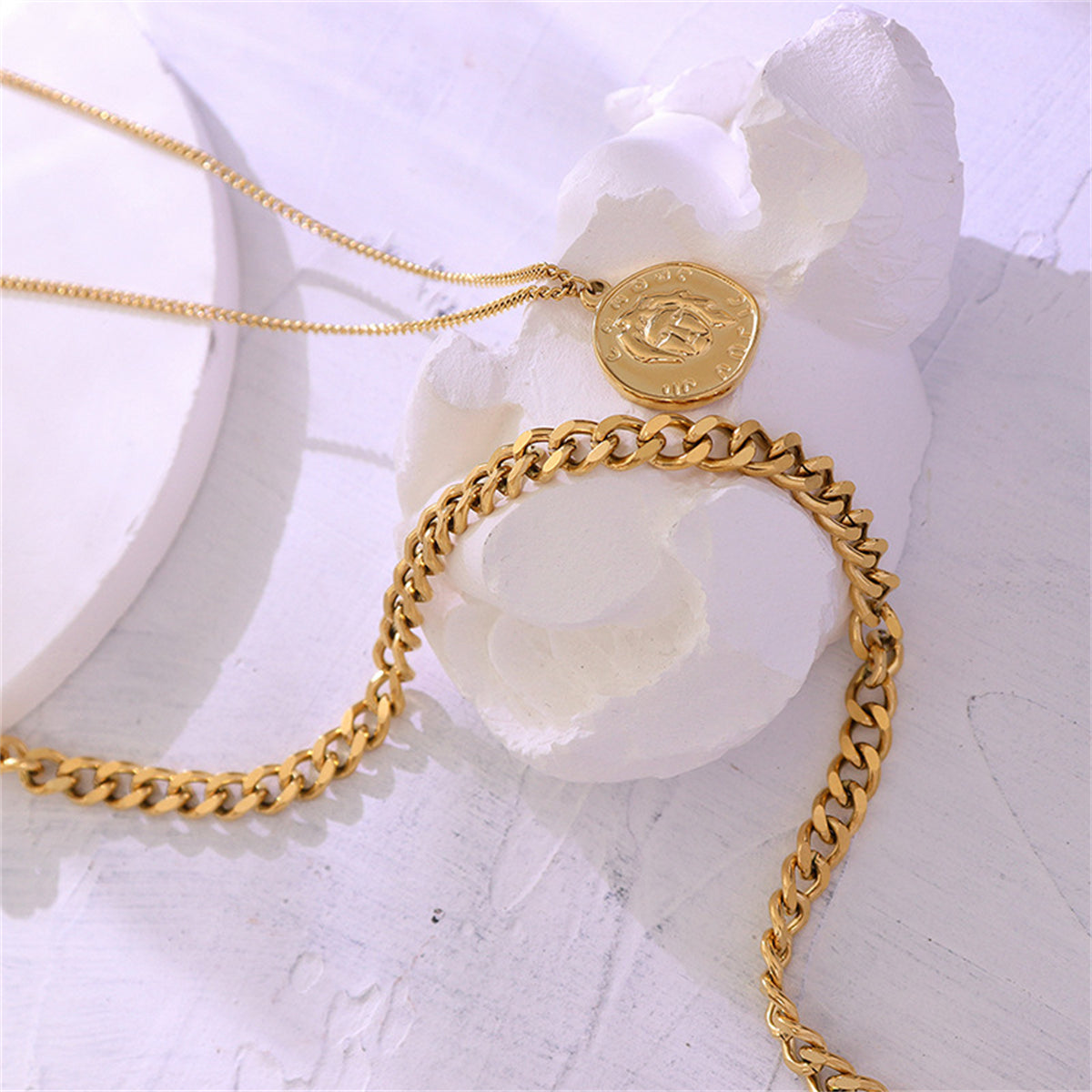 Chic 18K gold-plated Cuban chain necklace adorned with a layered coin pendant, adding a touch of luxury to your style.