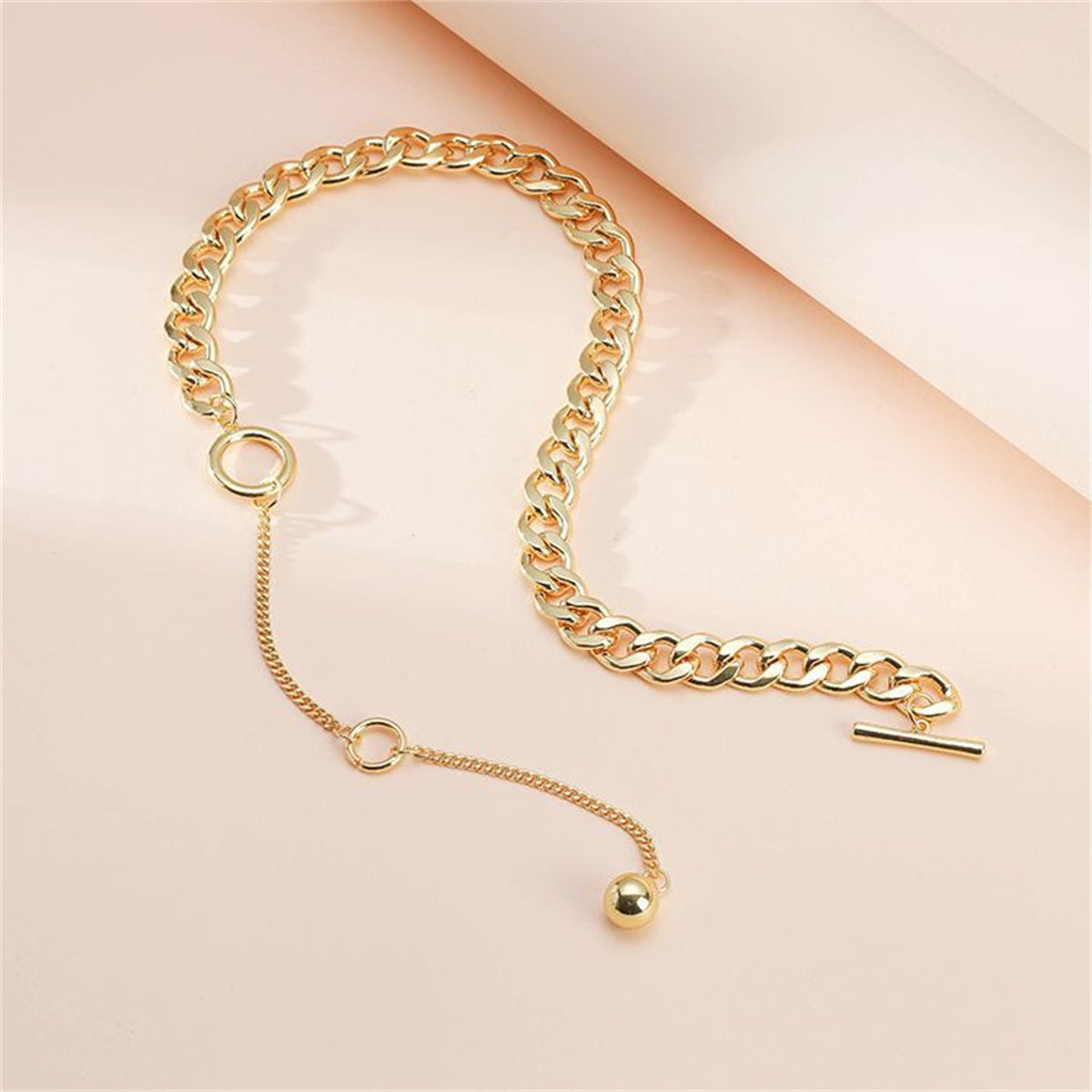 Beautifully designed 18K gold-plated chain bracelet adorned with a small gold charm, ideal for elevating your jewelry collection.