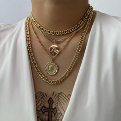 Chic gold chain necklace with a layered coin charm, made from 18K gold plating for a timeless and elegant appeal.