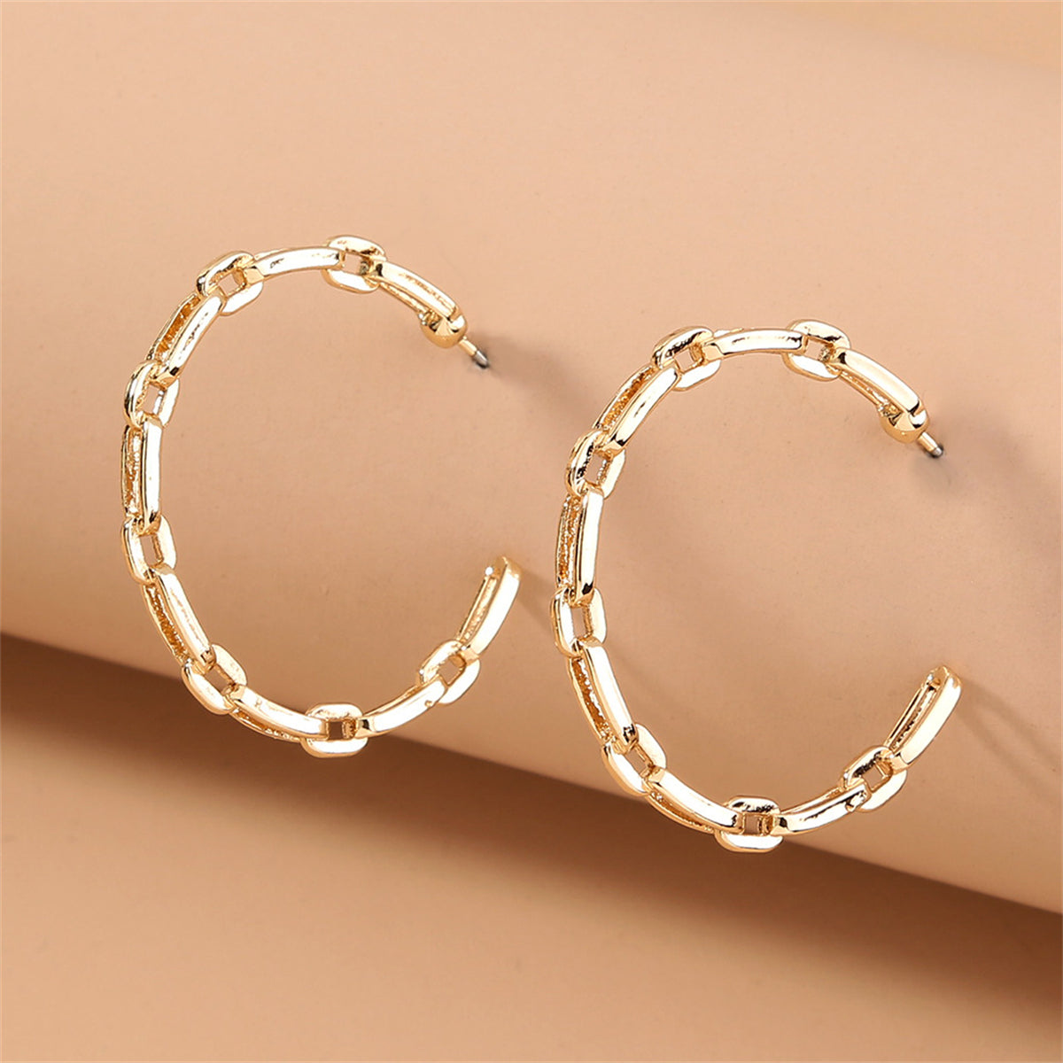 Beautiful 18K gold-plated chain hoop earrings showcasing a trendy link design, perfect for enhancing your outfit.