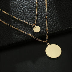 Beautifully crafted 18K gold-plated layered necklace with two gold disc pendants, ideal for a chic and stylish look.