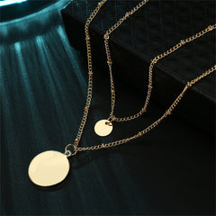 Dazzling 18K gold-plated necklace adorned with two gold disc pendants, a perfect accessory for any occasion.