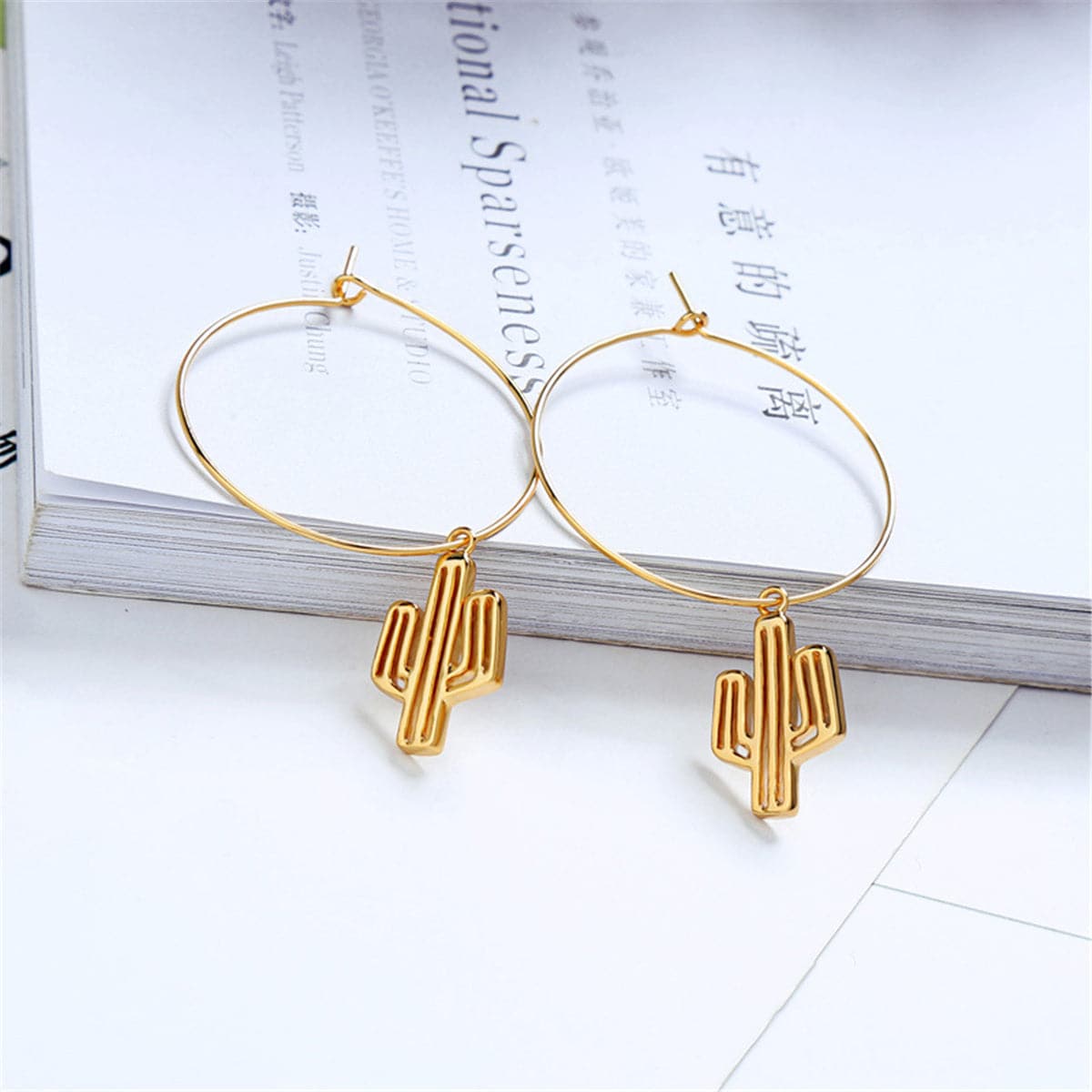 Trendy 18K gold-plated hoop earrings with a playful cactus design, perfect for those who love to express their style.