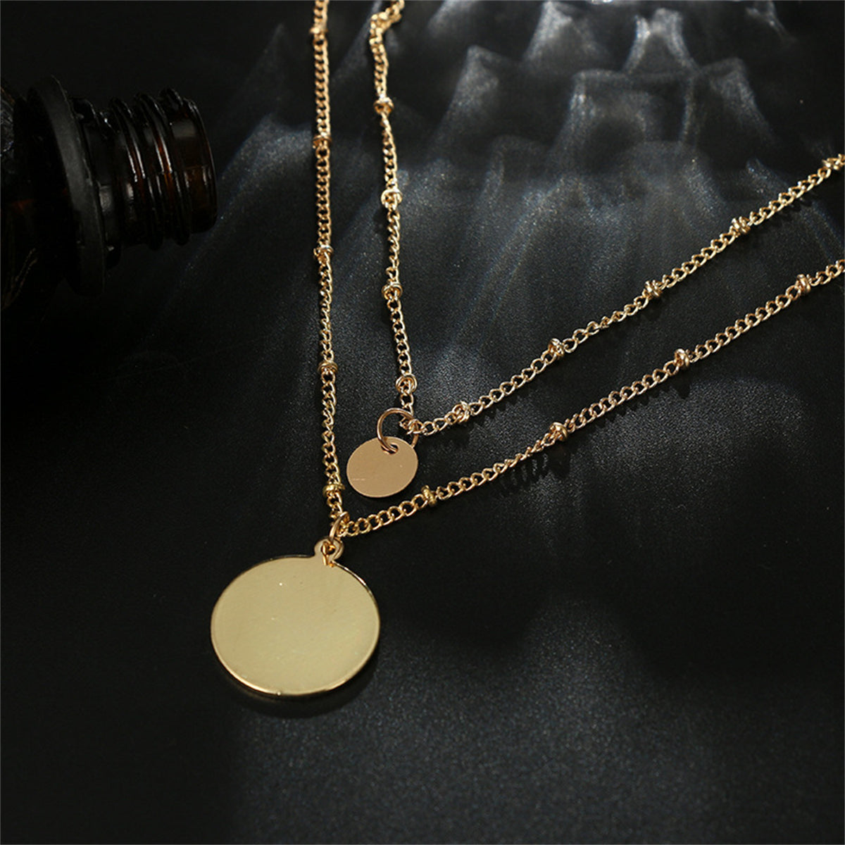 Chic 18K gold-plated layered necklace featuring two radiant gold disc pendants, a must-have for your jewelry collection.