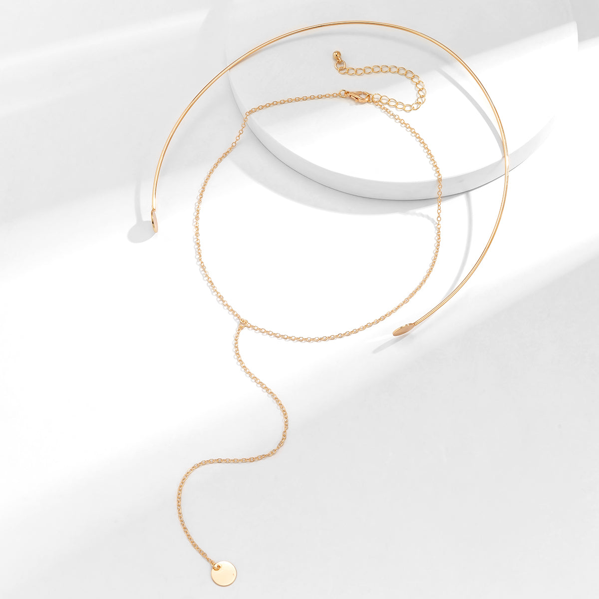 Stylish 18K gold-plated choker necklace adorned with a beautiful circle charm, a must-have accessory.