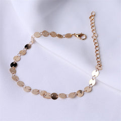 Beautifully crafted 18K gold-plated anklet with a mariner chain design and a charming disc, ideal for stylish wear.