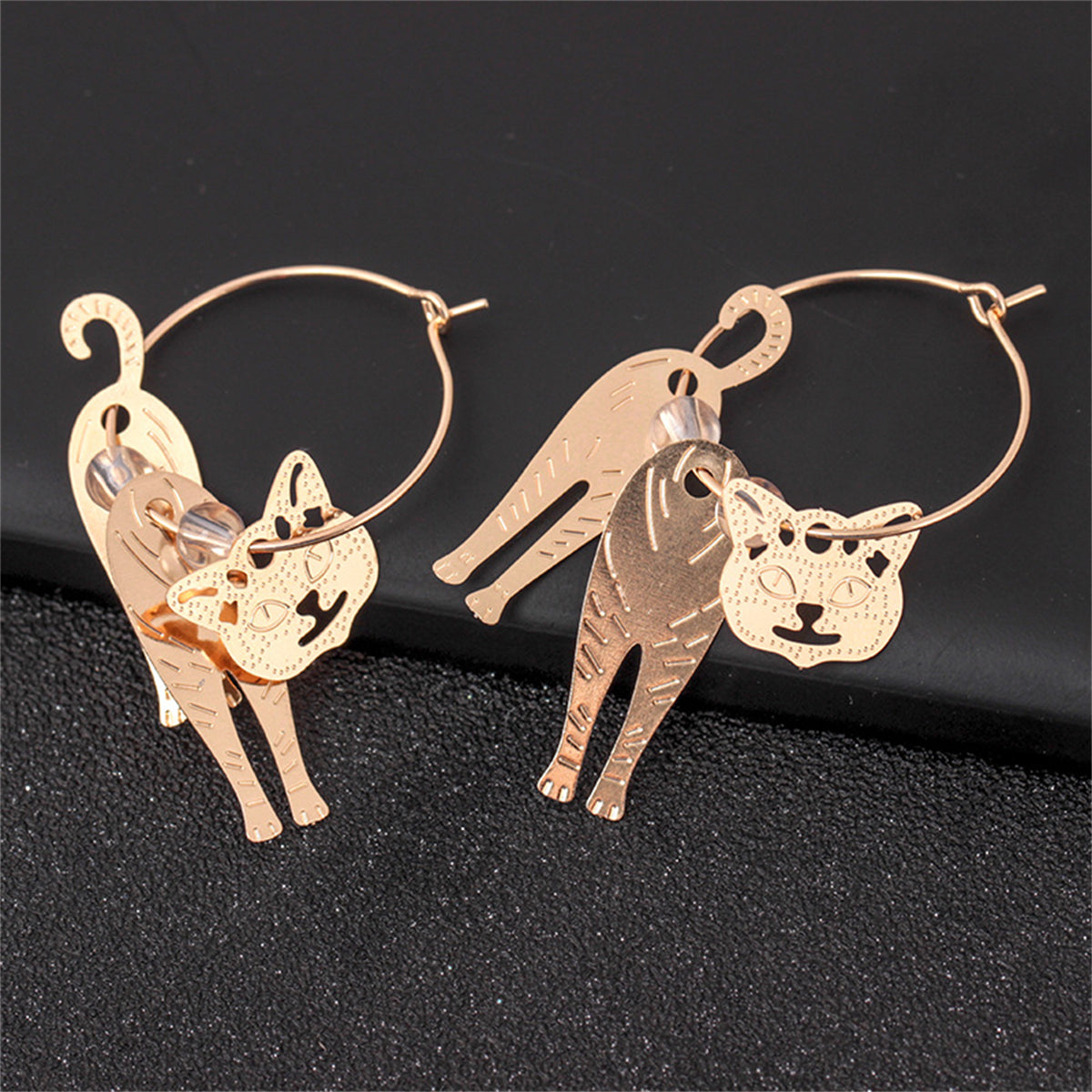 Stylish 18K gold-plated earrings showcasing cute cat charms, perfect for expressing your love for felines.