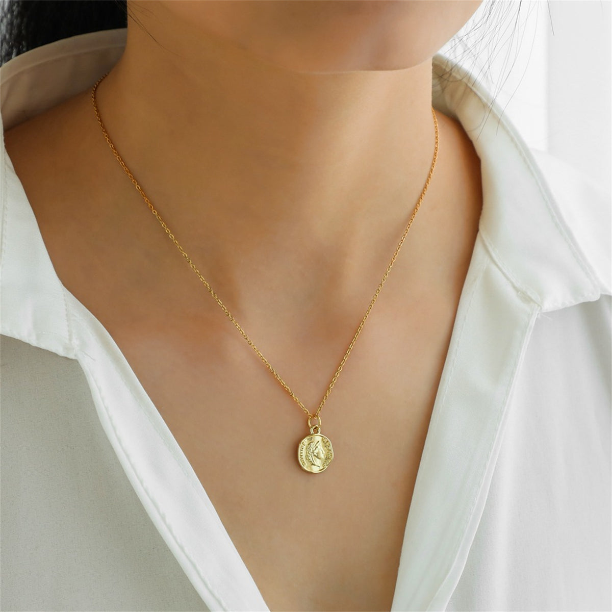 18K gold-plated coin pendant necklace displayed elegantly on a clean white background, highlighting its luxurious design.