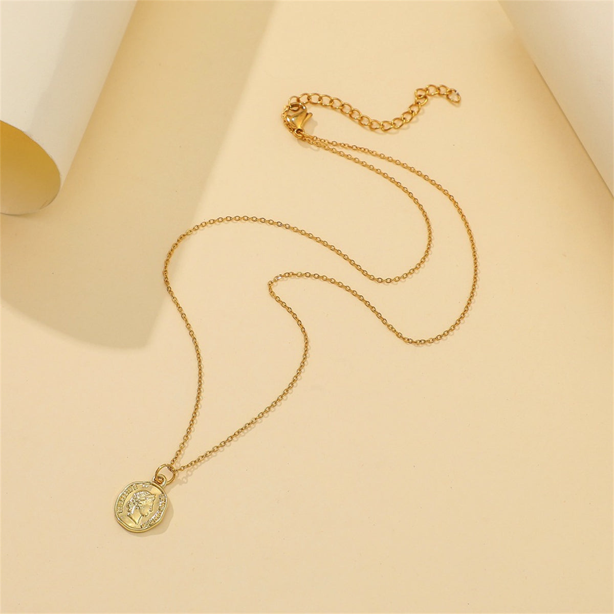 Elegant 18K gold-plated coin pendant necklace featured on a white background, showcasing its beauty and craftsmanship.