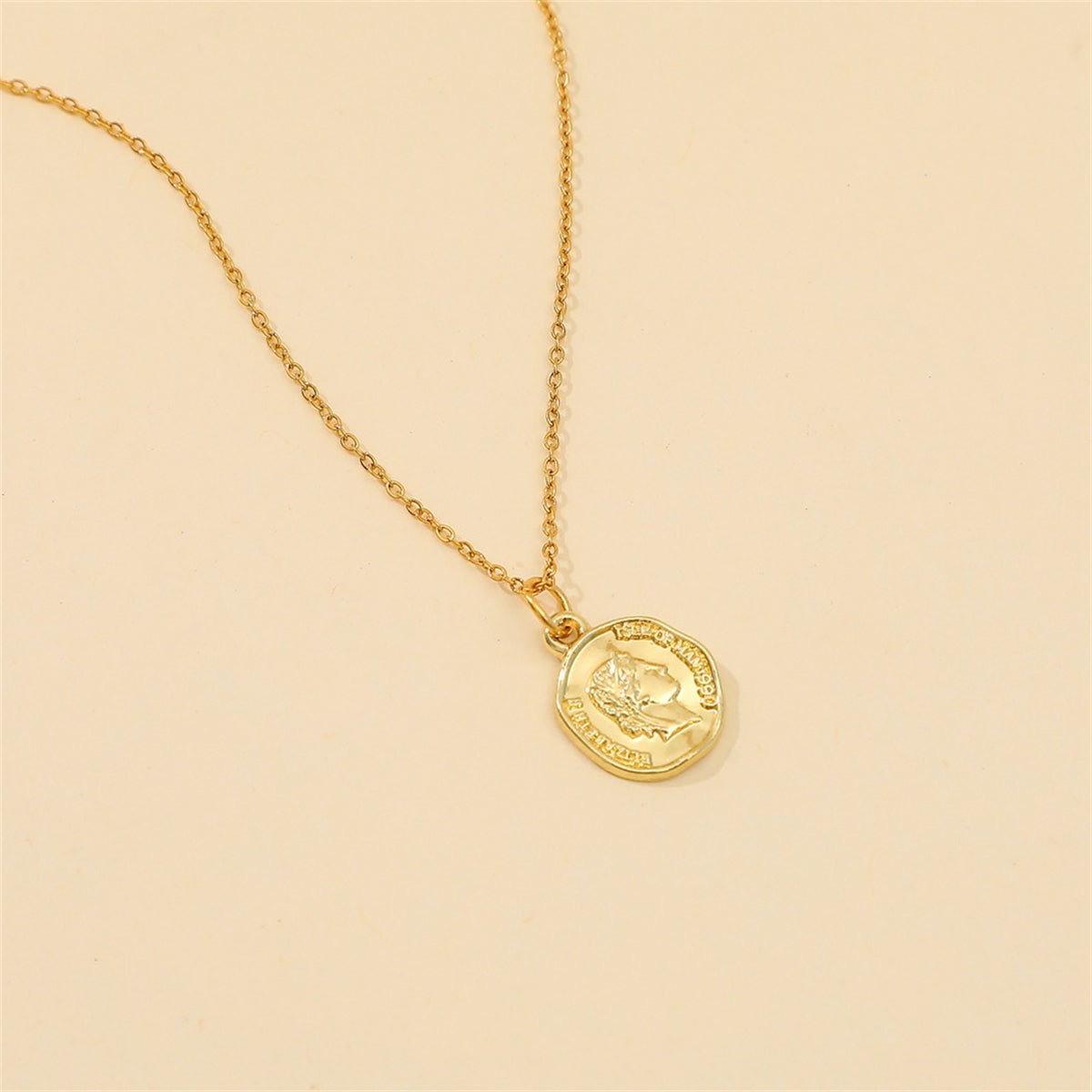 Beautiful 18K gold-plated coin pendant necklace set against a white background, highlighting its exquisite design and shine.