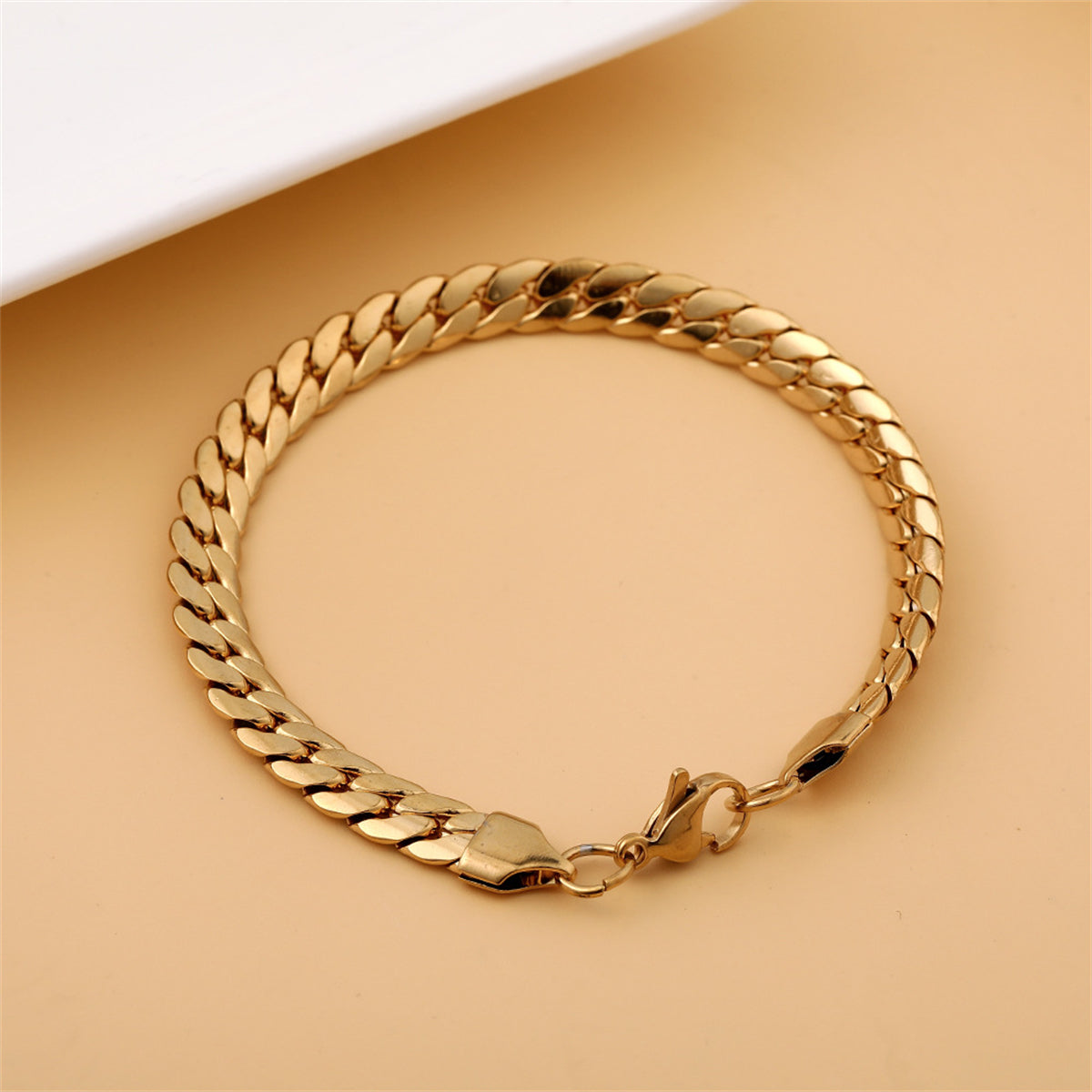 Stunning 18K gold-plated bracelet with a bold curb chain, adding a touch of luxury to your jewelry collection.