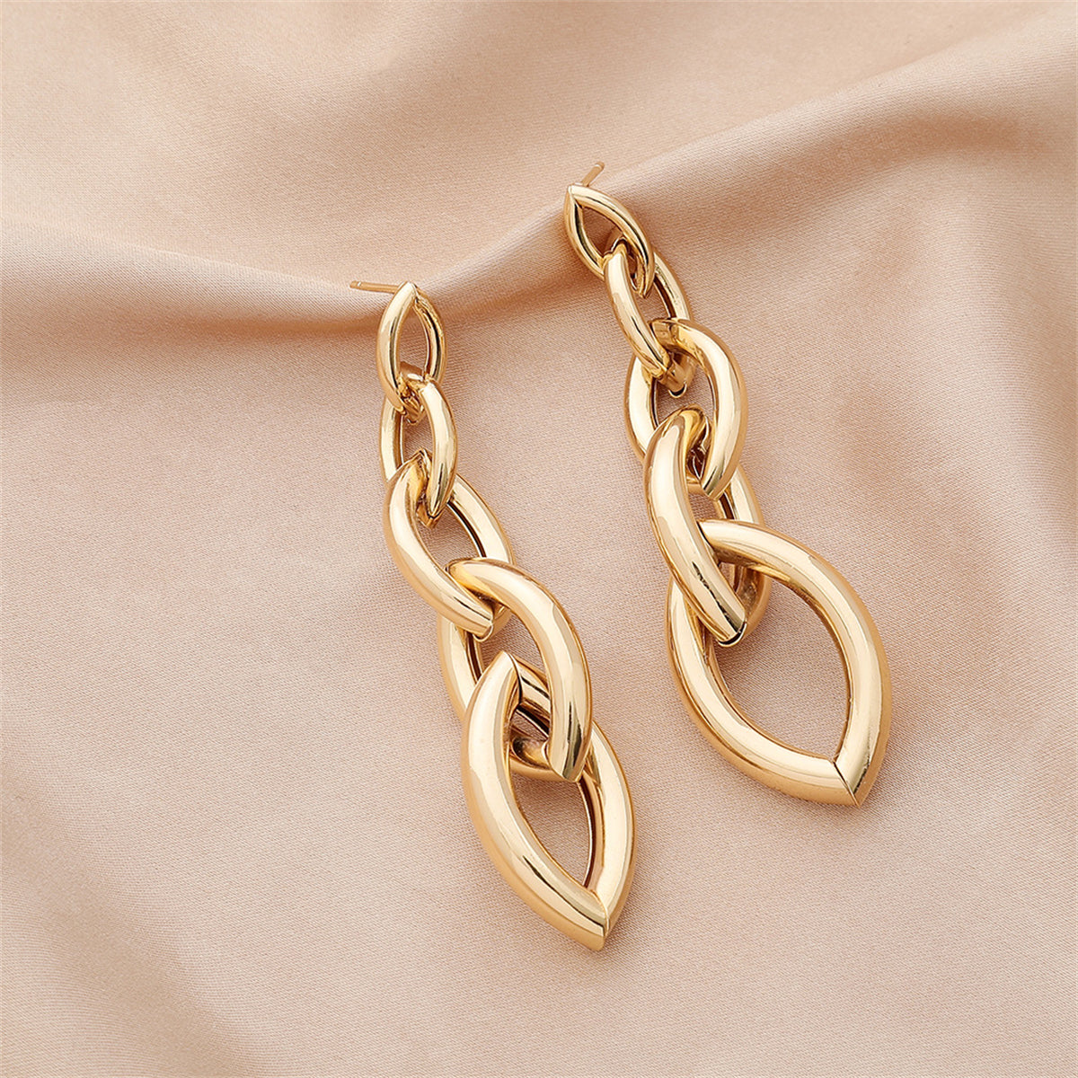 Beautifully crafted 18K gold-plated chain drop earrings showcasing a large oval design, ideal for a chic statement.