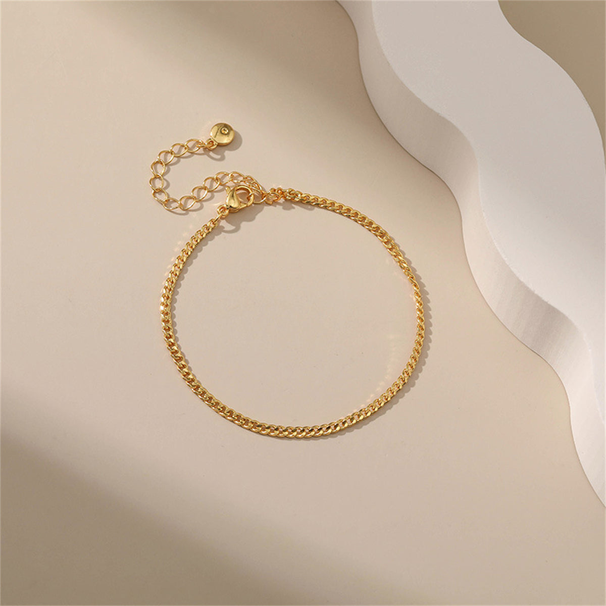 Dazzling 18K gold-plated curb chain bracelet with a subtle small chain link, perfect for elevating your everyday elegance.