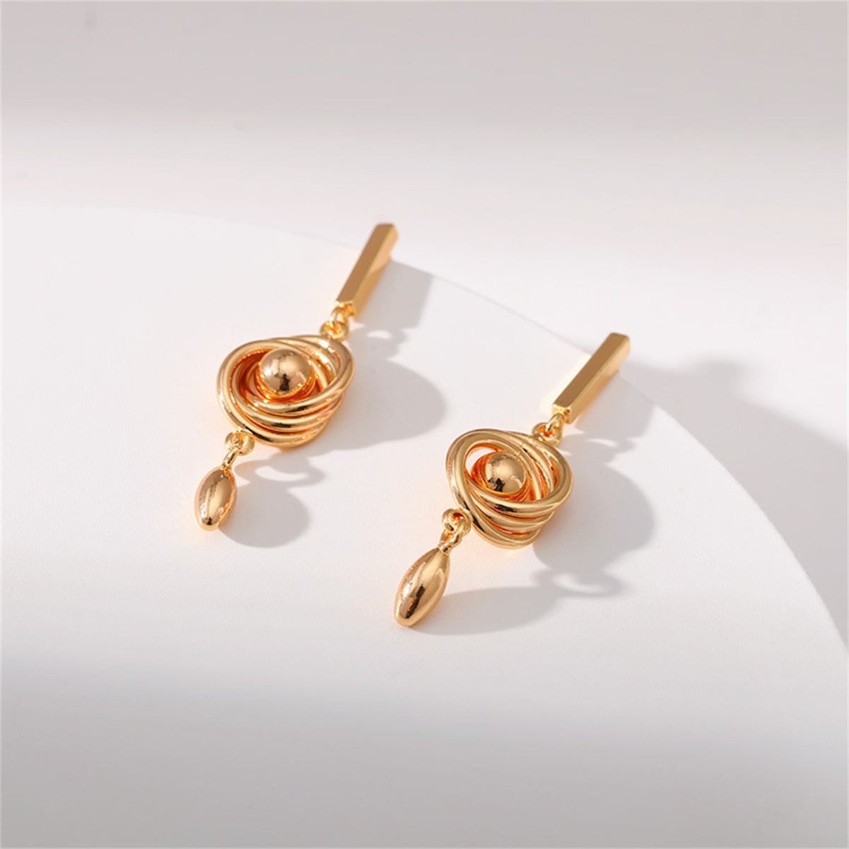 18K gold-plated earrings with a unique spiral design, adding a touch of elegance to your jewelry collection.