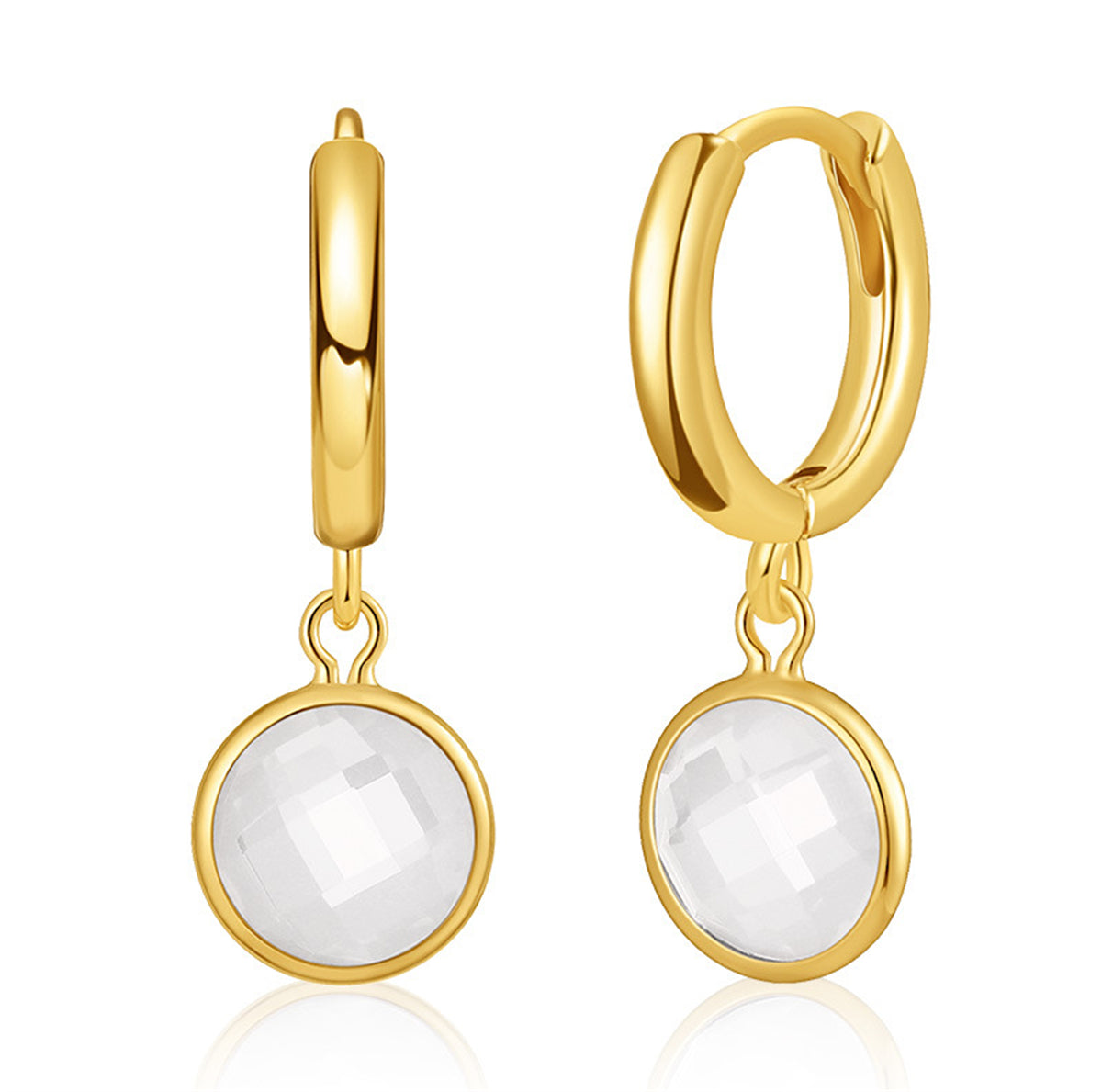 Gold-plated round huggie earrings featuring white crystal, elegantly designed for a sophisticated look.