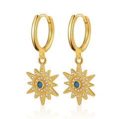 Gold-plated sun earrings adorned with blue cubic zirconia stones, featuring a huggie design for a stylish look.