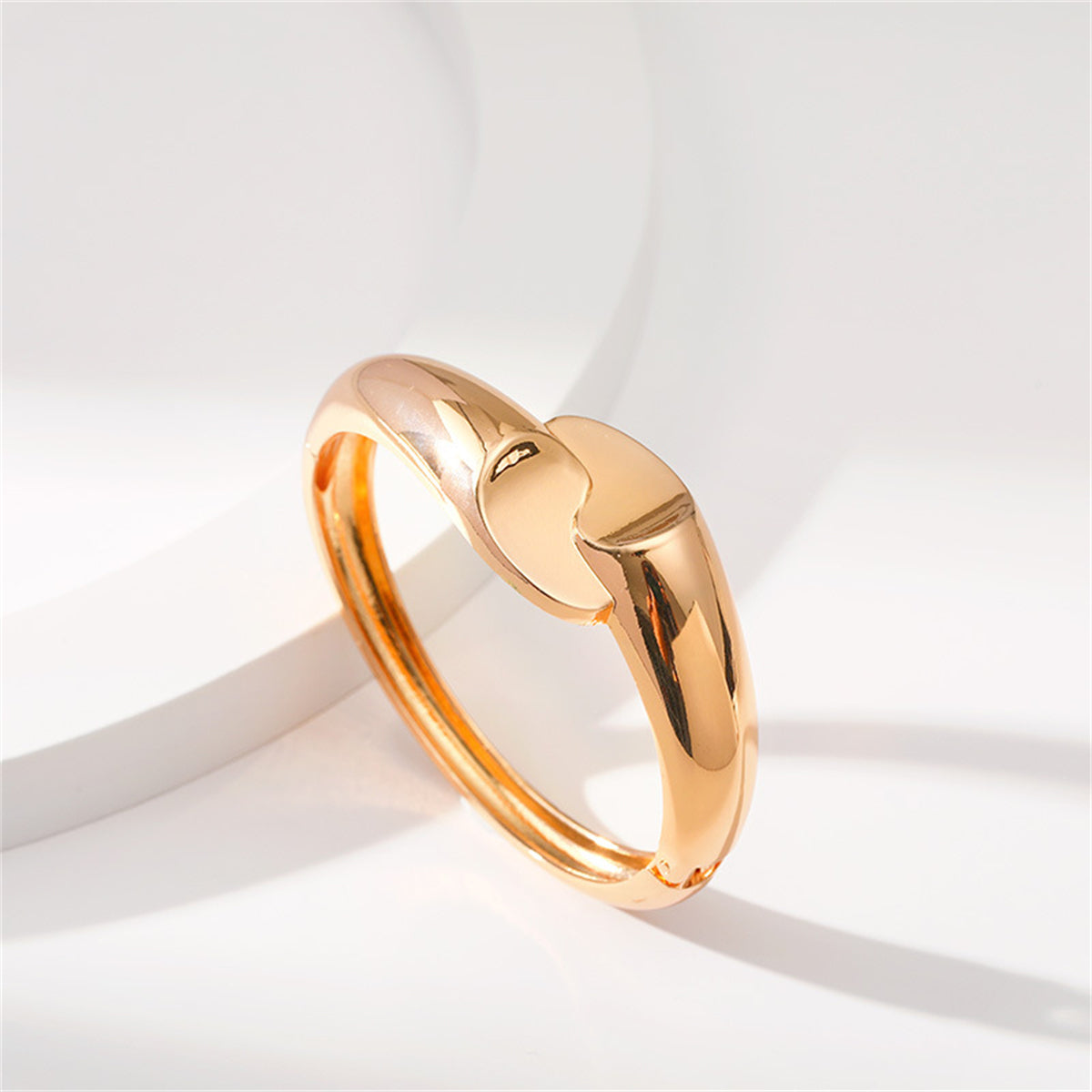 Chic 18K gold-plated bangle with a bypass style, elegantly designed with two hearts, ideal for expressing love and style.