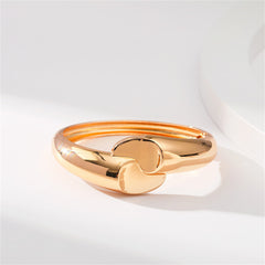 Beautiful 18K gold-plated bangle with a distinctive comma hinge, adorned with two hearts, perfect for any occasion.