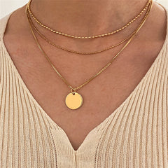 Elegant 18K gold-plated layered necklace featuring a disc pendant and two delicate chains for a chic look.