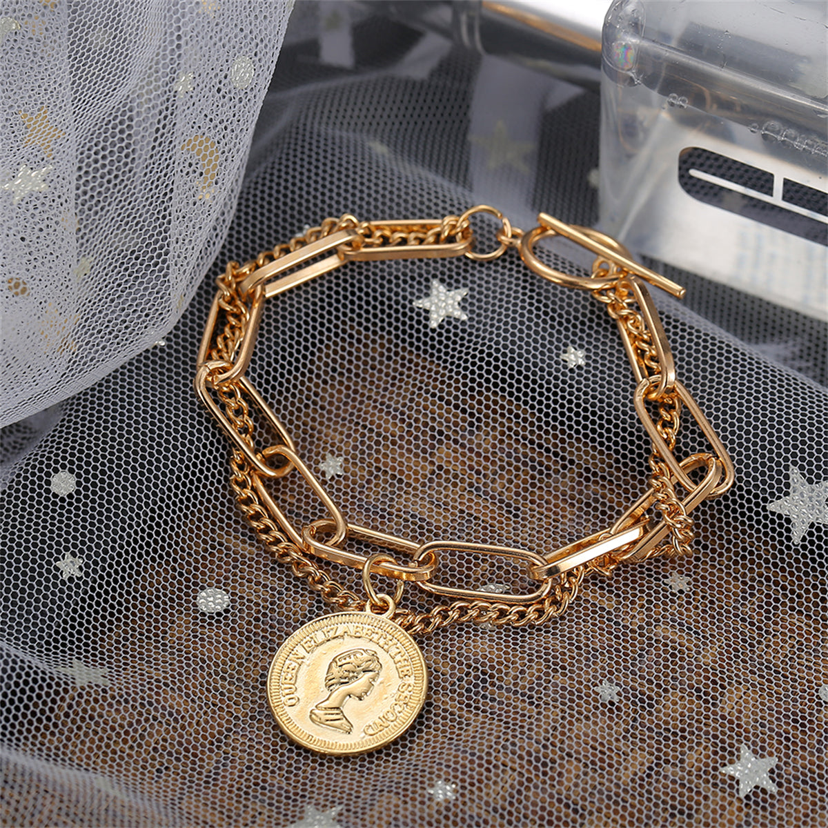 Beautifully designed 18K gold-plated bracelet with a coin charm, a must-have accessory for a trendy and elegant style.