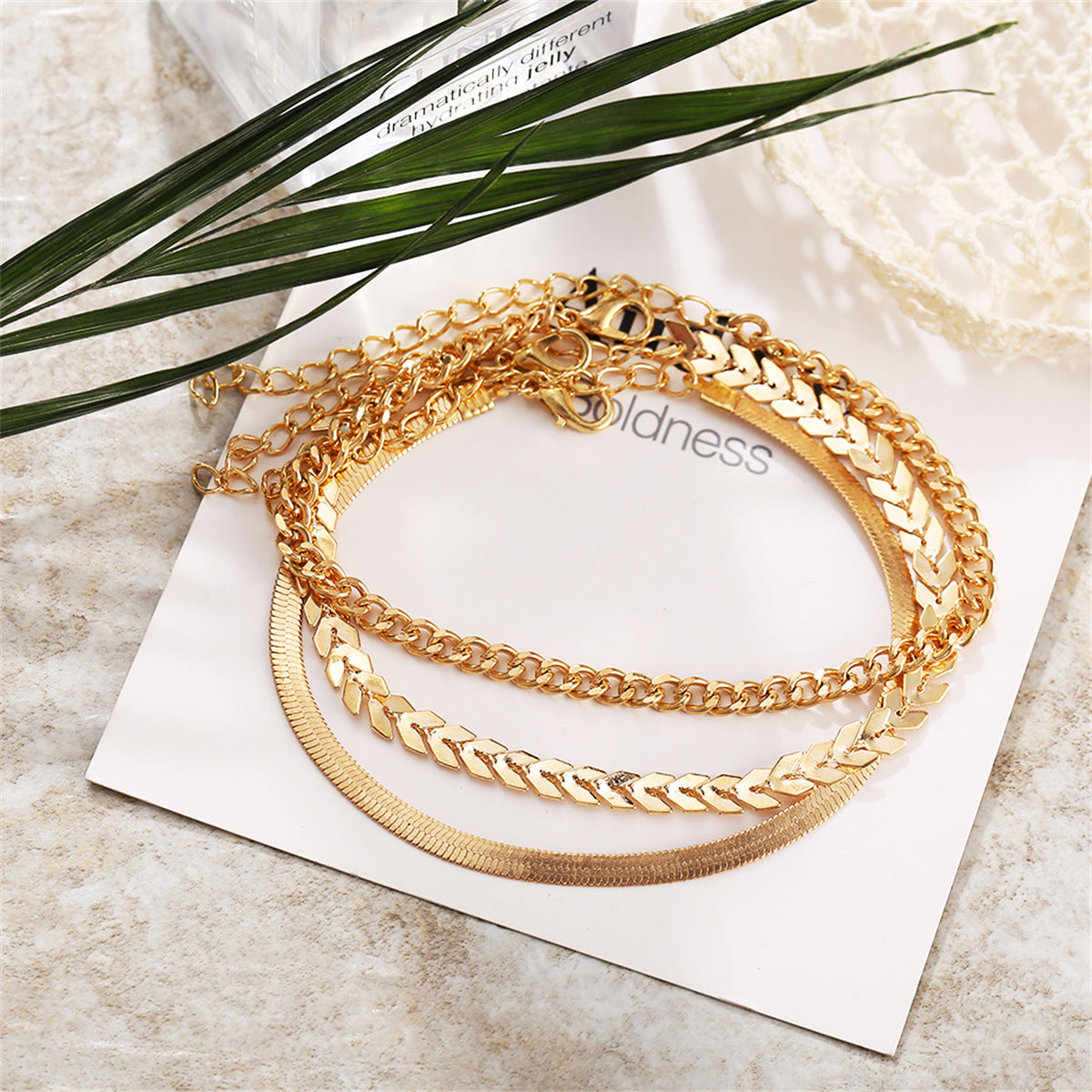 Chic 18K gold-plated layered chain anklet, a must-have accessory for a sophisticated and trendy appearance.