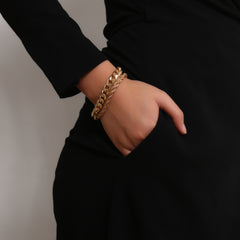 A stunning set of two 18K gold-plated chain bracelets, one curb and one rope, beautifully linked together.