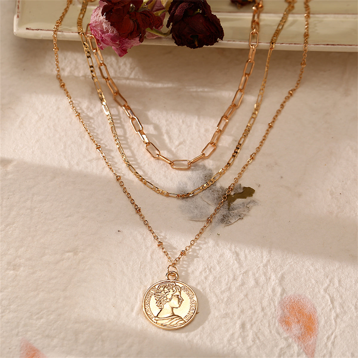 Beautifully crafted 18K gold-plated necklace showcasing a layered coin pendant, a must-have for fashion-forward individuals.