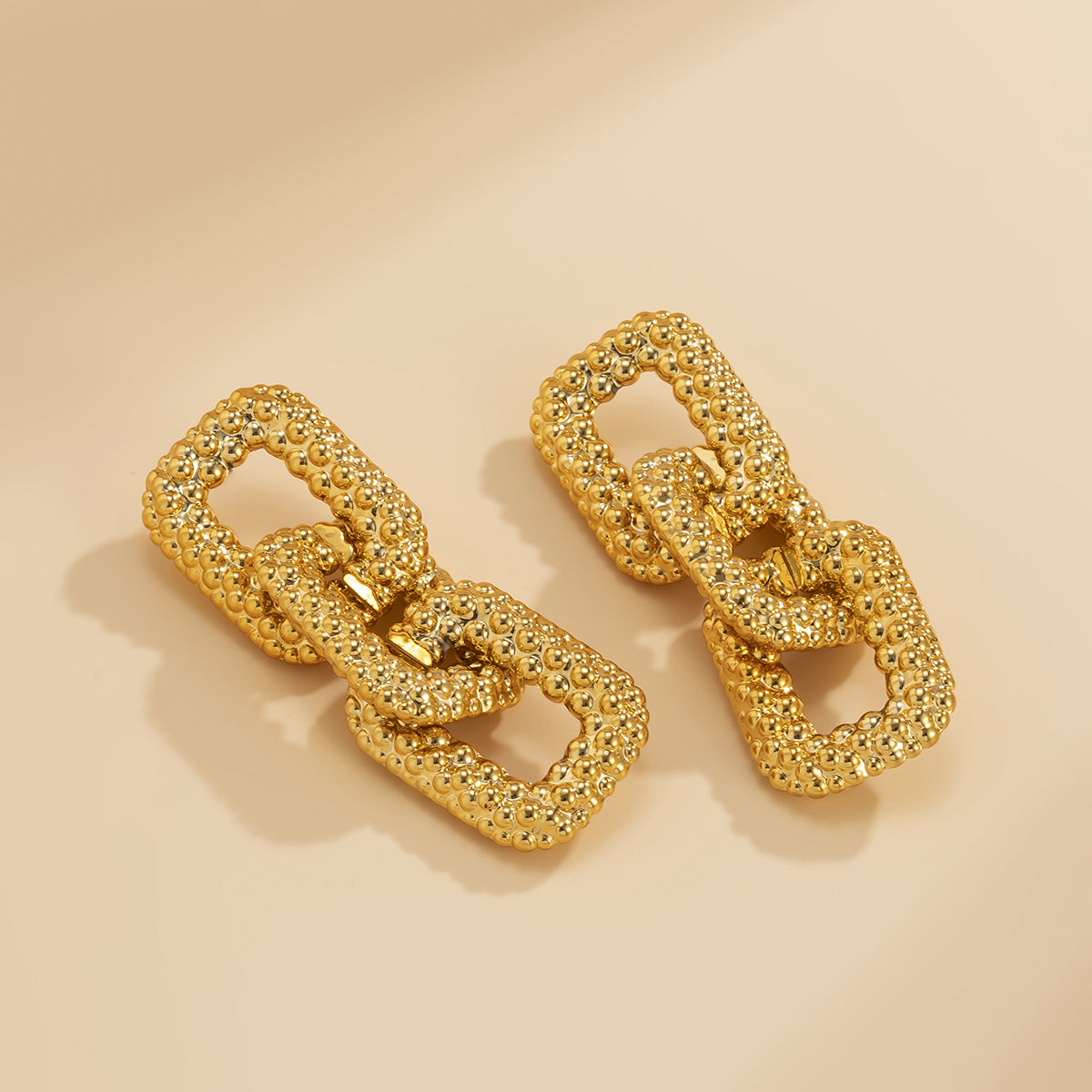 Fashionable 18K gold-plated chunky chain link drop earrings, crafted from a series of links for a bold, gold-toned look.