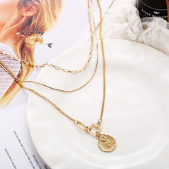 Stylish 18K gold-plated necklace with a unique coin charm, ideal for layering and elevating your everyday look.