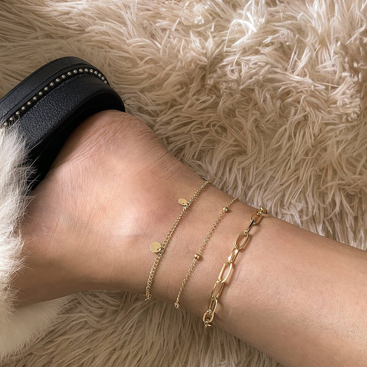 A stunning trio of gold chain anklets with chain links, ideal for elevating your accessory game with 18K gold plating.