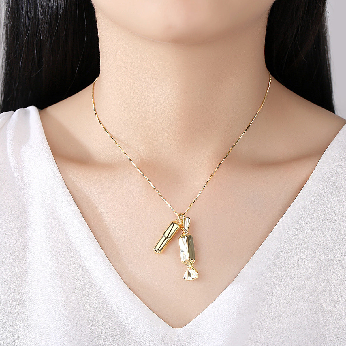 Chic 18K gold-plated necklace featuring a candy bar and pill pendant, a perfect accessory for those who love quirky elegance.