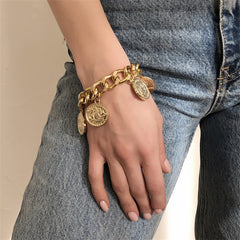 Chic 18K gold-plated charm bracelet with four eye-catching gold coins, a timeless piece for any fashion enthusiast.