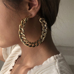 Stunning 18K gold-plated curb chain hoop earrings crafted from metal, showcasing a striking large chain for a chic look.