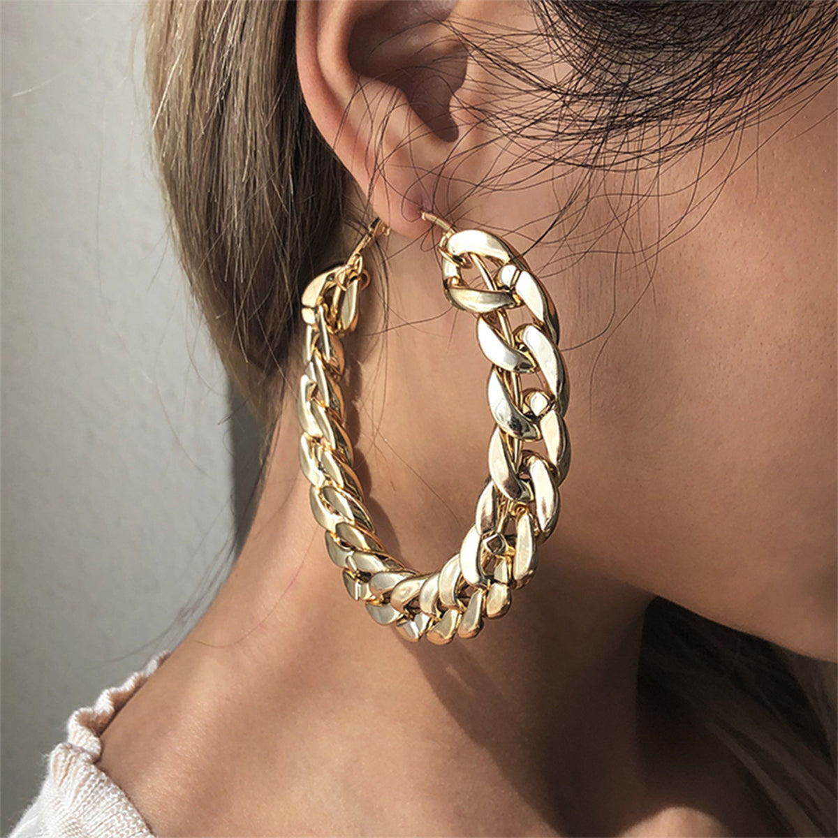 Elegant 18K gold-plated curb chain hoop earrings in metal, designed with a prominent large chain for a fashionable statement.