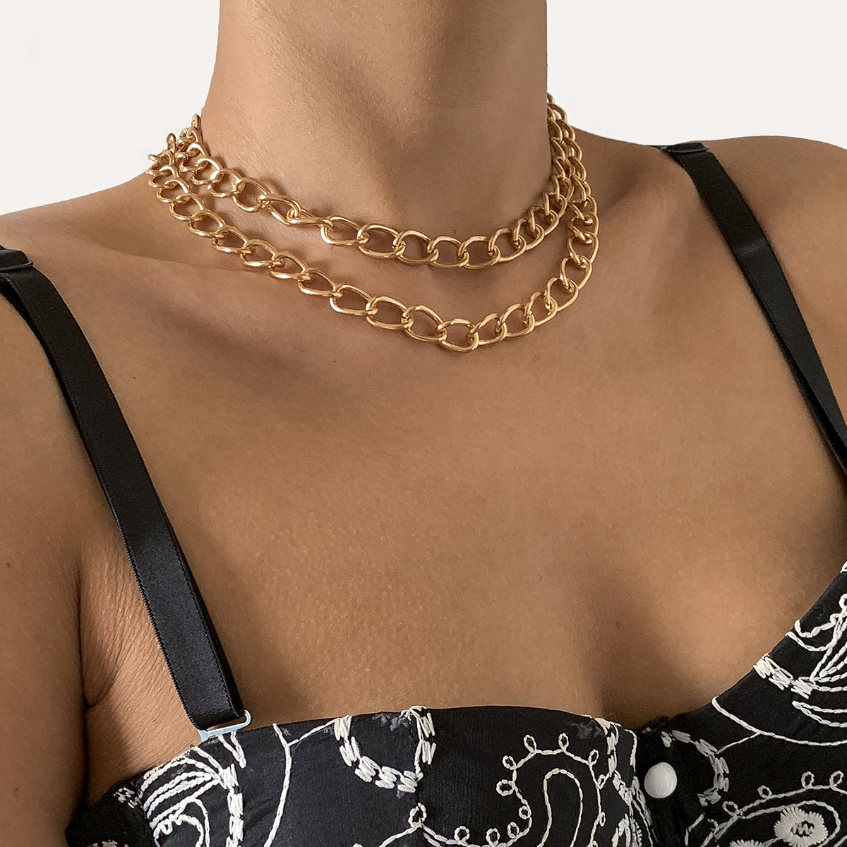 Beautiful 18K gold-plated curb chain necklace, showcasing a sleek single strand of radiant gold metal.